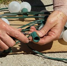 an older person is working on some electrical wires and plugged in with the cord