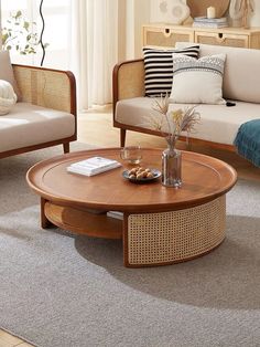 a living room with two chairs and a coffee table in the middle of the room