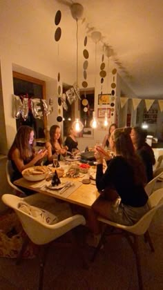 a group of people sitting around a table eating food