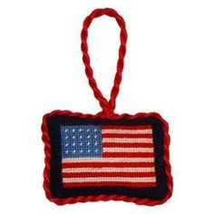 an american flag ornament hanging from a rope