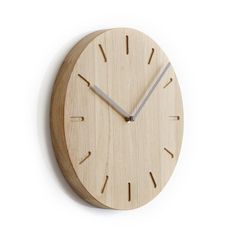 a wooden clock with silver hands on a white background