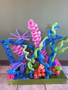 there is a sculpture made out of plasticine and some sort of seahorses