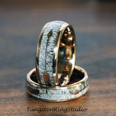 two wedding rings made out of gold and silver