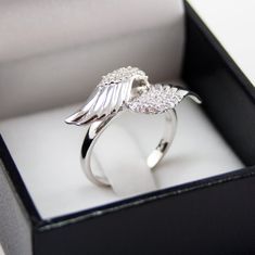 A lovely sterling silver Angel wings ring with beautiful simulated diamonds. Finished in rhodium for a longer lasting shine, this ring is the perfect touch of class and sophistication. Please select ring size in down bar, thank you! * Officially Licensed Product - passed through examination and requirements by the Sorority. In addition, part of the sales proceeds goes back to Pi Beta Phi. * Product includes lifetime warranty: We pride ourselves in our high quality products and stand by our craft Angel Accessories, Aesthetic Ring, Angel Wing Ring, Aesthetic Rings, Fashion Angels, Party Aesthetic, Necklace Moon, Rings Women, Girl Accessories