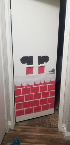 a door decorated to look like a brick wall