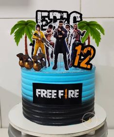 a birthday cake with an image of the characters from fortnite on top and palm trees in the background