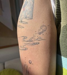 a person with a tattoo on their arm