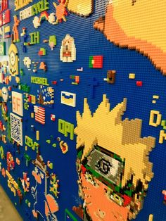 a wall covered in legos and pictures