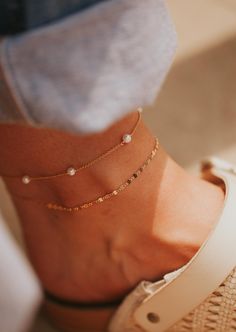 We are head over ankles for pearls! This cable pearl anklet is adorned with the most preciously placed pearls making for a dreamy ethereal feel. A summer must-have. Choose from two sizes: 8.5"-9" and 9.5"-10". Available in 14kt Gold Fill + Sterling Silver. Shown with our Stella Anklet. Handmade in Eau Claire, WI. Our jewelry is handmade so each piece will be unique and may vary slightly from what is pictured. Cute Anklets, Adornment Jewelry, Everyday Wear Jewelry, Pearl Anklet, Gold Bracelet Chain, Chain Anklet, Anklet Jewelry, The Pearl, Jewelry Cleaner