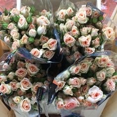 a bouquet of roses is wrapped in plastic and ready to be shipped into the store