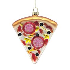 a christmas ornament shaped like a slice of pizza with toppings on it