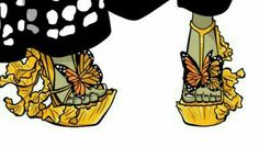 the legs and shoes of a woman with butterflies on them