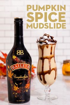 a bottle of bailey's pumpkin spice mulled next to an ice cream sundae