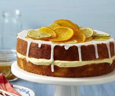 a cake with orange slices and icing on top