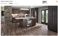 an image of a kitchen with wood flooring and stone wall in the background that says, warm grey oak