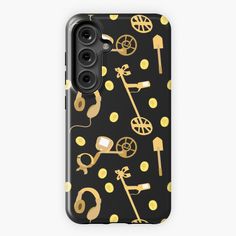 an iphone case with gold and black golf related items on the front, along with polka dots