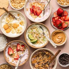 a table topped with bowls filled with different types of food and desserts next to each other