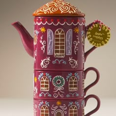 a purple tea pot with windows on it