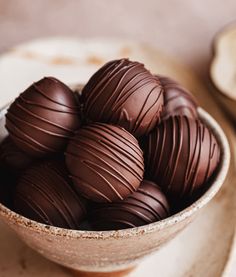 a bowl full of chocolates sitting on top of a table