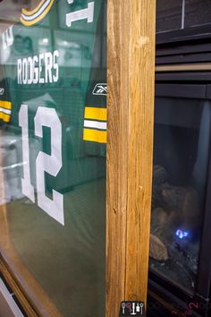 the green bay packers jersey is reflected in the window