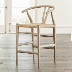 a wooden chair sitting on top of a hard wood floor