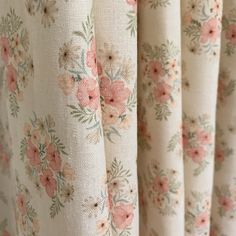 the back of a curtain with pink flowers on it