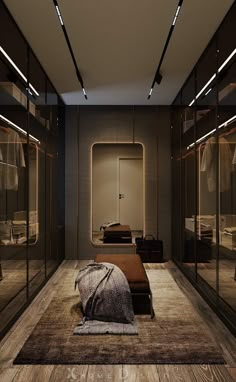 a bedroom with mirrored closet doors and a bed in the middle on top of a rug