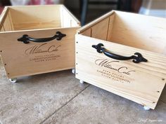 two wooden boxes sitting on top of a table next to each other with black handles