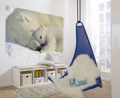 there is a stuffed polar bear in the room next to a hanging hammock