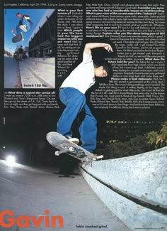 a man riding a skateboard up the side of a cement wall in front of a building