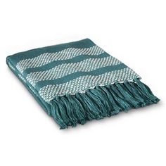 a green and white blanket with fringes on it