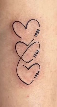 a tattoo with two hearts on it