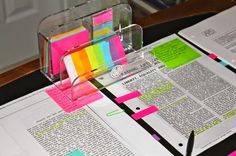 an open book with colorful sticky notes on it