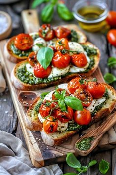 two slices of bread topped with tomatoes and basil