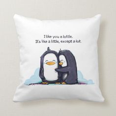 a white pillow with two penguins hugging each other on it's back and the words i like you, you a lot