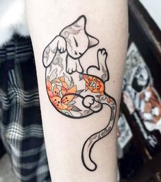 a small tattoo on the arm of a cat with flowers in its tail and paw