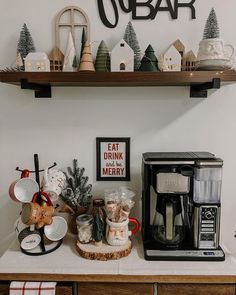 a coffee bar with christmas decorations on the shelves