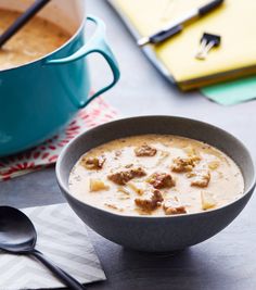 a bowl of soup with meat and cheese in it