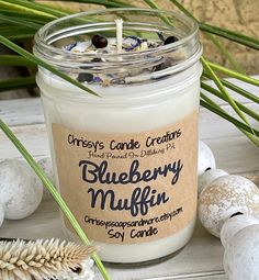 blueberry muffin soy candle surrounded by sea shells