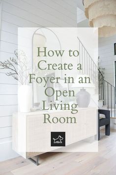 an open living room with white walls and wood floors is featured in the article how to create a foyer - in - an open living room