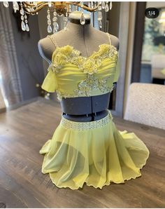 a yellow dress on display in a store