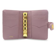 a pink wallet with a gold clasp on it