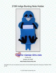 an image of a crocheted blue bird holding a blank paper in it's hands