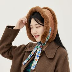 Myungssom, a modern design brand with Korean traditional beauty. Korean traditional thermal earmuffs 'Bolkki' are simple cold weather items that cover the cheeks, ears, and chin. Made of Korean-style quilted fabric with faux merino wool and faux mink trim, it can be used as earmuffs or neck warmers. It is convenient because it is made of cotton quilt and artificial fur and can be hand washed. It is 24 inches long and 4 inches wide, suitable for any adult female. You can see more product photos o Fur Neck Warmer, Korea Winter Fashion, Earmuffs Outfit, Korea Winter, Fur Earmuffs, Winter Accessories Fashion, Neck Warmers, Traditional Beauty, Korean Hanbok