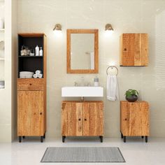 a bathroom with two wooden cabinets, a sink and a mirror on the wall next to a rug