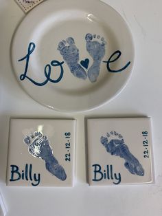 two plates with handprints on them are next to a plate that says love