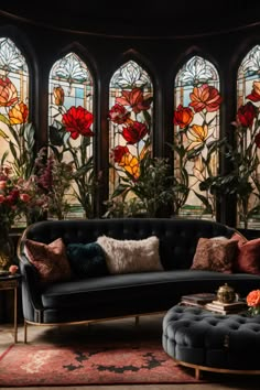 Immerse yourself in a living room that whispers Gothic romance. The stained glass windows, with their floral grace, cast a kaleidoscope of colors. Paired with plush seating, ornate furnishings, and fresh flowers, this space is where timeless elegance meets intimate opulence. Classic Stained Glass Windows, Stained Glass Aesthetic Dark, Floral Stained Glass Windows, New Classic Interior Design Living Rooms, Stained Glass Living Room, Wedding Stained Glass Ideas, Stained Glass Wedding Decor, Stained Glass Dining Room