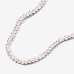 Introducing a new kind of classic with the Treated Freshwater Cultured Pearls T-bar Collier Necklace. This necklace features a row of tiny, elongated treated freshwater cultured pearls that close with an organically-shaped 14k gold-plated T-bar closure. Each treated freshwater cultured pearl is unique and can vary in size and colour; normal wear and tear may occur with this material. Our freshwater cultured pearls are treated with bleaching and lustre enhancement. - Pandora Treated Freshwater Cultured Pearls T-bar Collier Necklace - 14k Gold-plated unique metal blend / Treated freshwater cultured pearl / White - Sz. 17.7 in Pandora Essence, Custom Charm Bracelet, Pearl Charm Necklace, Solid Gold Necklace, Solid Gold Earrings, White Gold Necklaces, Ring Pendant Necklace, White Gold Earrings, Freshwater Cultured Pearls