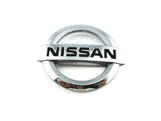 the nissan logo is shown on a white background and it appears to be made out of metal