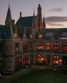 an old building with many windows lit up at night